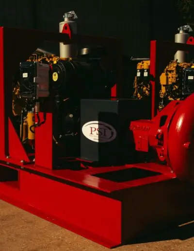 Specialized Industrial Pump Suppliers Diesel engine pump packages on red skids, ready for construction dewatering